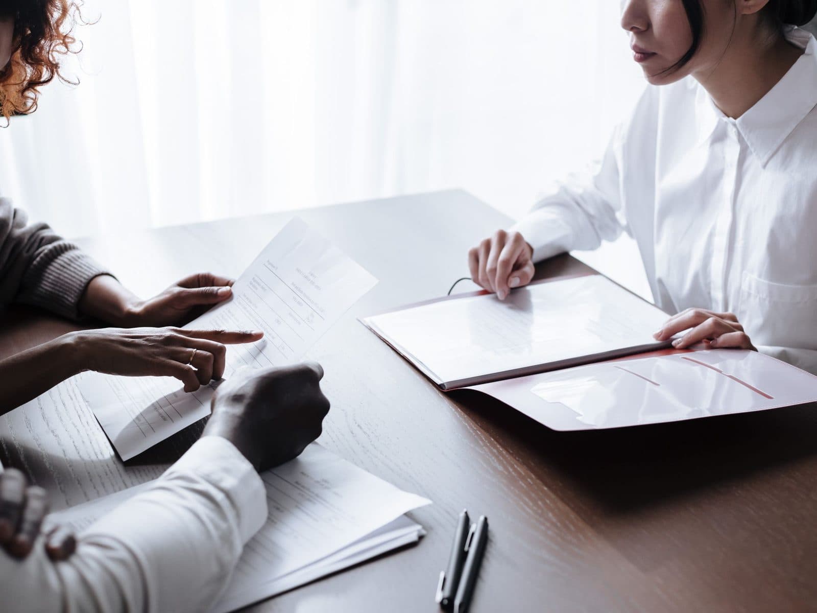 A WeCare consultant going through bankruptcy paperwork with a client